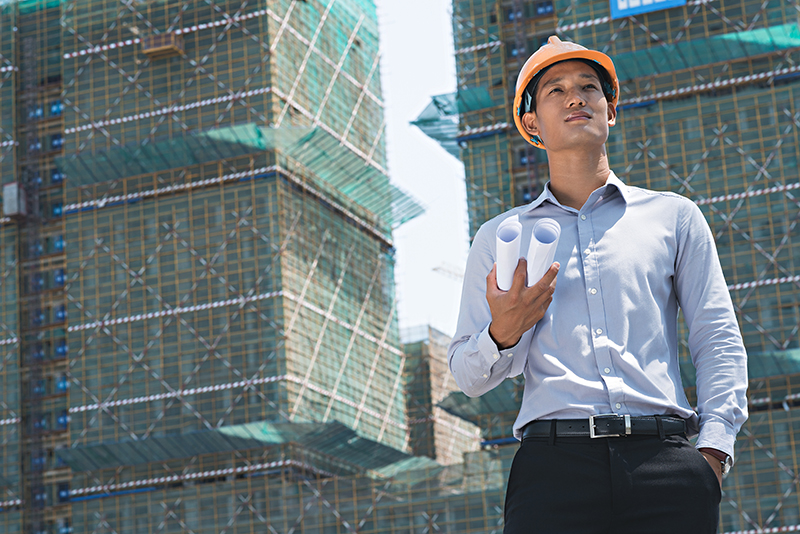 Engineer with blueprints